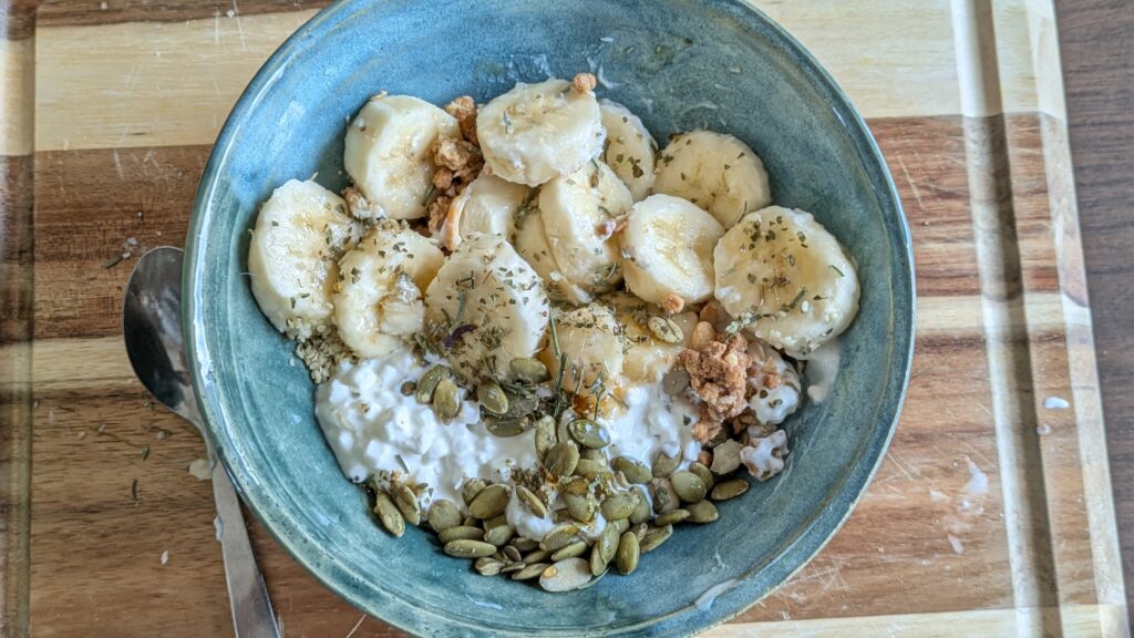 cottage cheese bowl, bananas, savory, pumpkin seeds, herbs, granola, honey