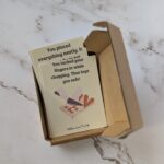 convcards peeking from the box