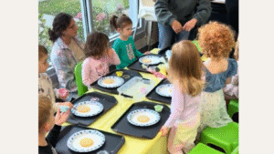 young toddlers sitting at a toddler cooking class