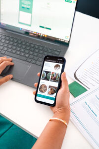 Hand showing the Kidchef app on phone screen